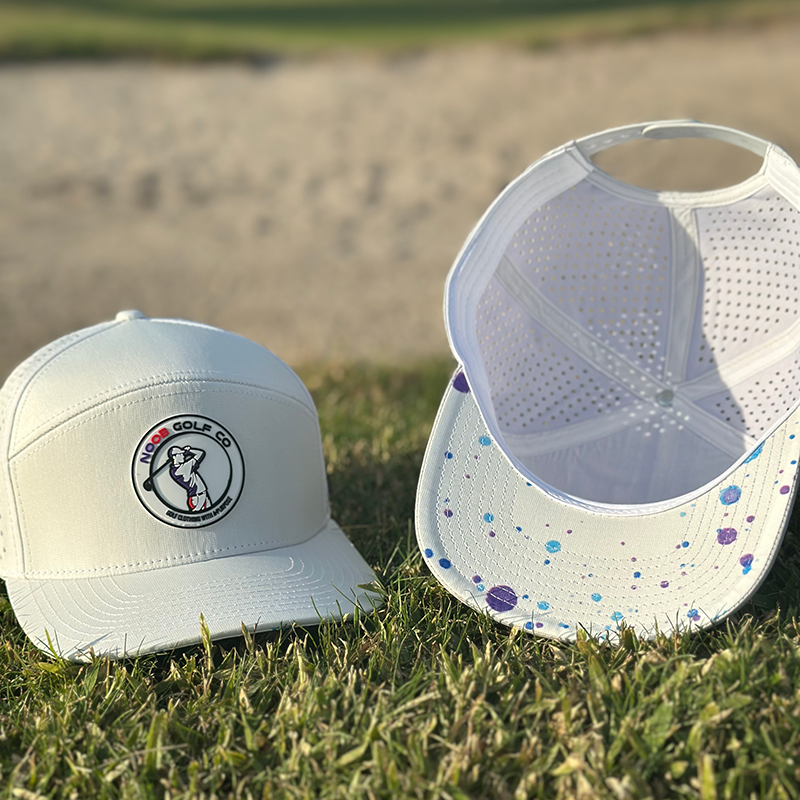 Stylish white Founders Cap with a wide brim, designed as a waterproof golf hat using HydroDri technology for all-weather play.